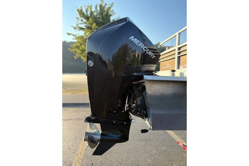 Slide: The Image of Mercury outboard motor on 2020 Sun Tracker SportFish 22 XP3 boat, parked outdoors. - 47