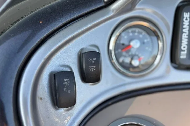 Slide: The Image of Dashboard controls of 2020 Sun Tracker SportFish 22 XP3 boat, featuring navigation and court lights. - 41