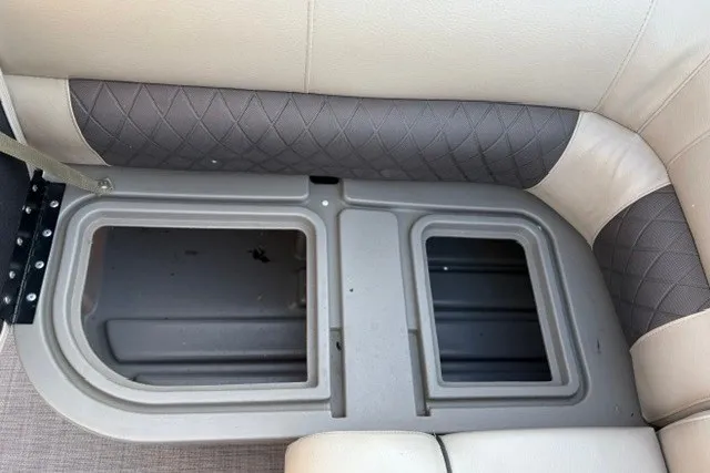 Slide: The Image of Storage compartment in 2020 Sun Tracker SportFish 22 XP3 boat with cushioned seating. - 49