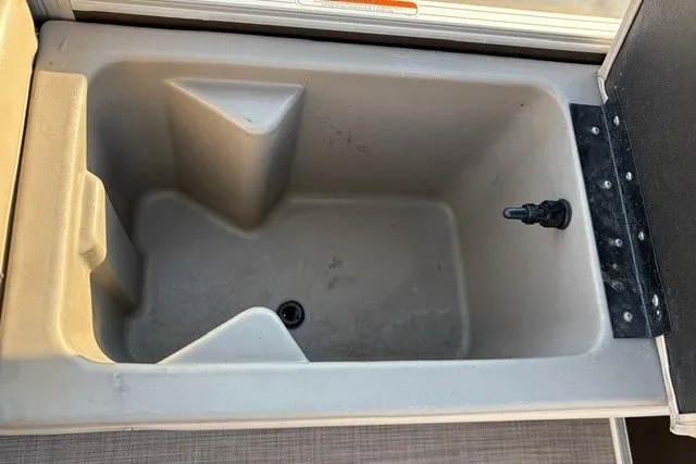 Slide: The Image of Built-in storage compartment on 2020 Sun Tracker SportFish 22 XP3 boat. - 51