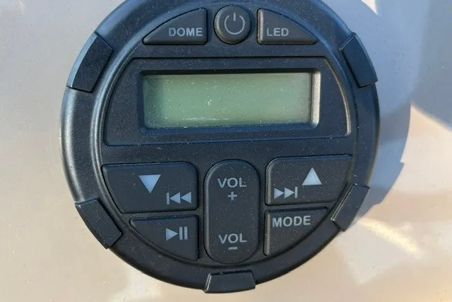 Slide: The Image of Control panel of a 2020 Sun Tracker SportFish 22 XP3 boat, featuring buttons and display. - 46