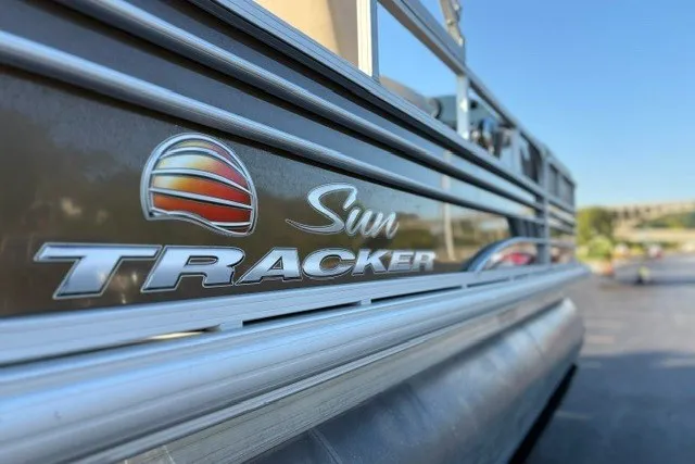 Slide: The Image of 2020 Sun Tracker SportFish 22 XP3 pontoon boat, close-up of logo and side view. - 16