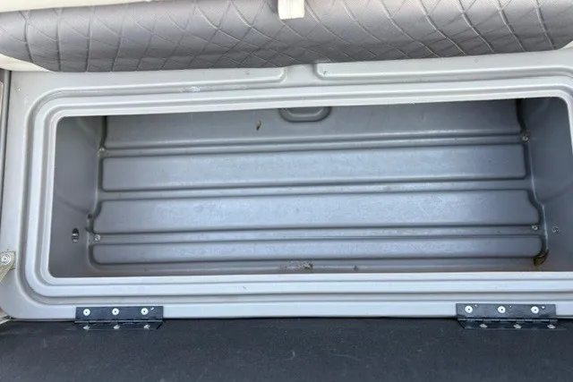 Slide: The Image of Storage compartment of 2020 Sun Tracker SportFish 22 XP3 boat, open and empty. - 24