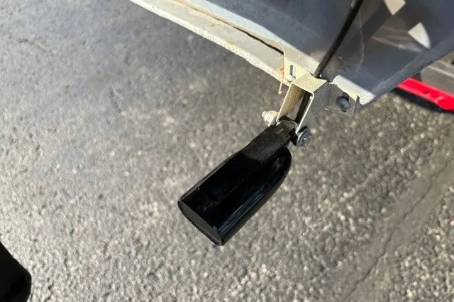Slide: The Image of Close-up of a 2020 Sun Tracker SportFish 22 XP3 boat component on pavement. - 20