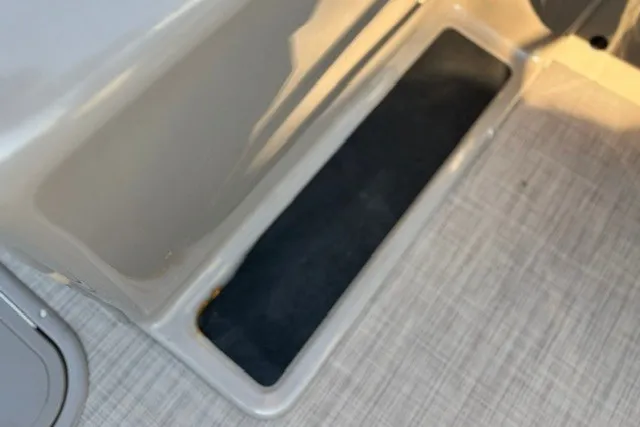 Slide: The Image of Storage compartment on 2020 Sun Tracker SportFish 22 XP3 boat interior. - 39