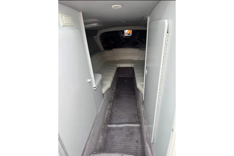 Slide: The Image of Interior of 2001 Formula 353 FASTech boat with white seating and gray flooring. - 27