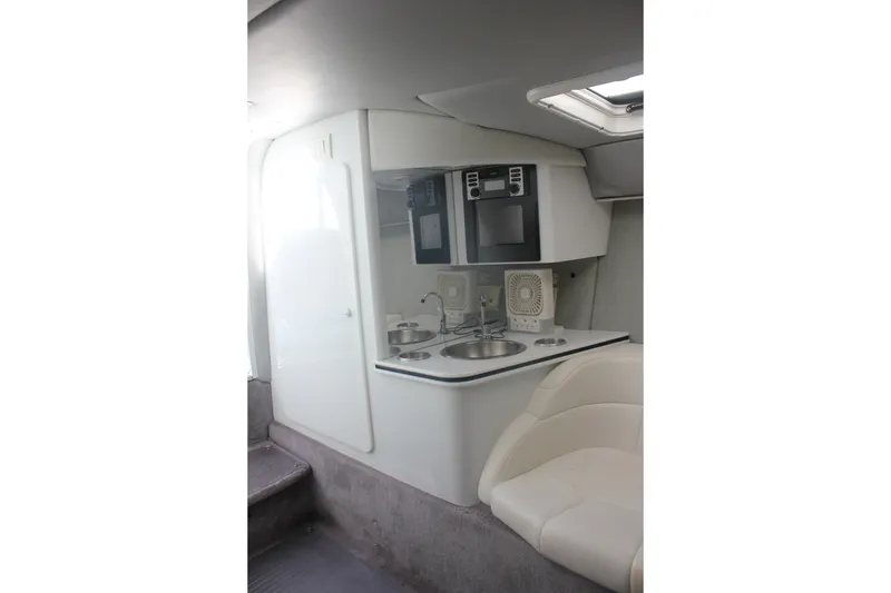 Slide: The Image of Interior of 2001 Formula 353 FASTech boat with kitchenette and seating area. - 32