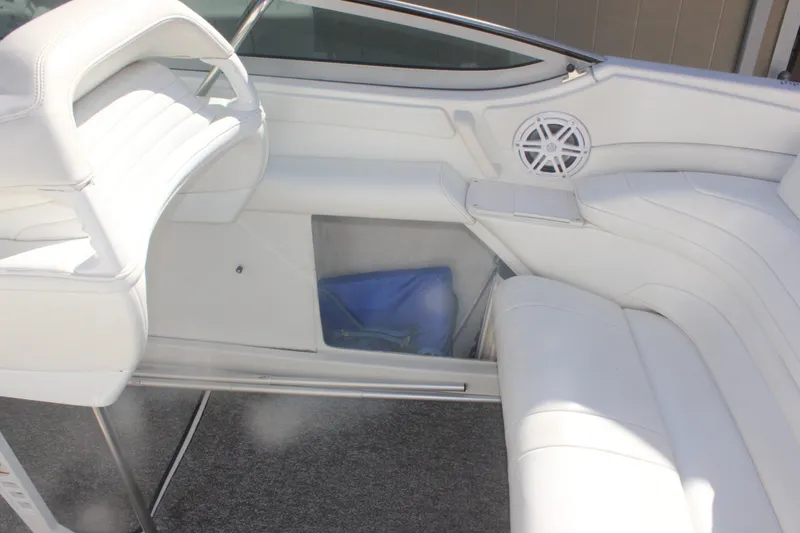 Slide: The Image of Interior of 2001 Formula 353 FASTech boat with white seating and speaker. - 24