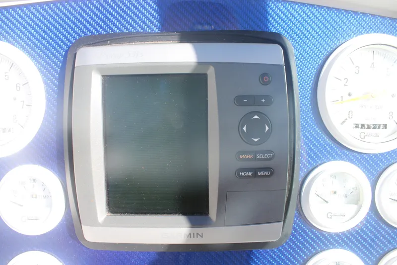 Slide: The Image of Garmin GPS device on 2001 Formula 353 FASTech dashboard with gauges. - 17