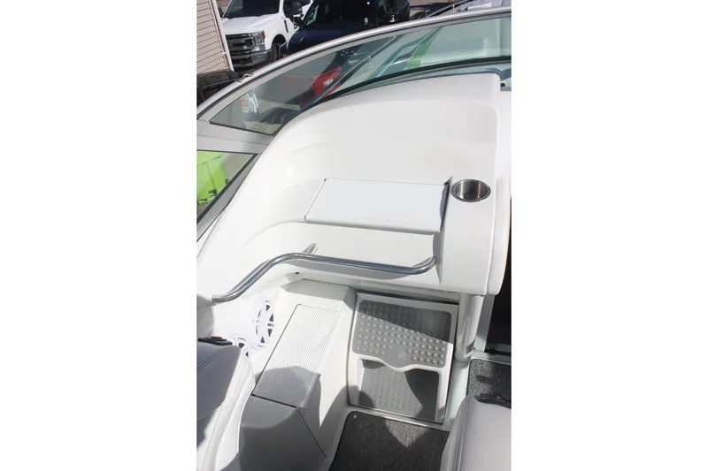 Slide: The Image of 2001 Formula 353 FASTech boat interior with white seating and cup holder. - 20