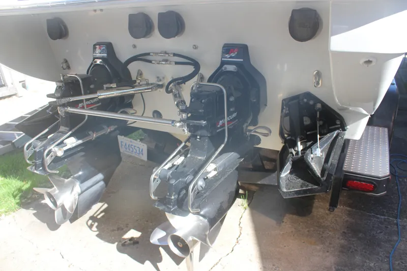 Slide: The Image of Rear view of a 2001 Formula 353 FASTech boat with dual Mercury outdrives. - 39