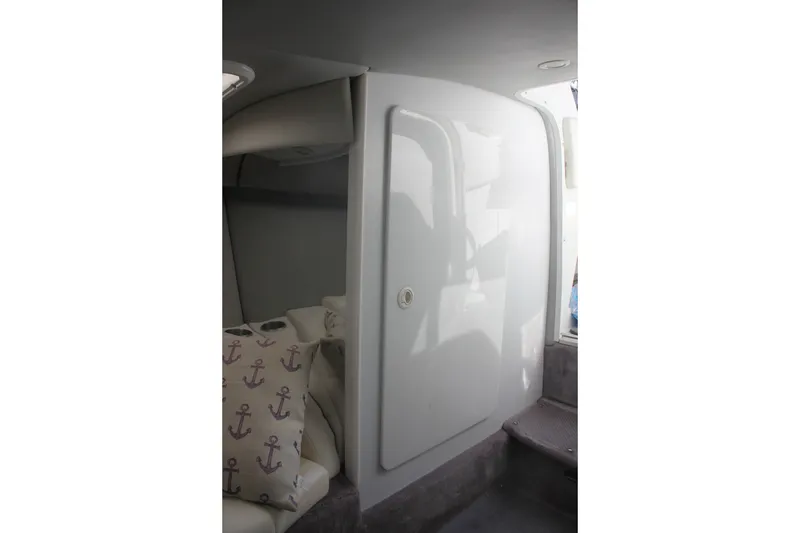 Slide: The Image of 2001 Formula 353 FASTech cabin interior with anchor-themed pillows and sleek white door. - 33