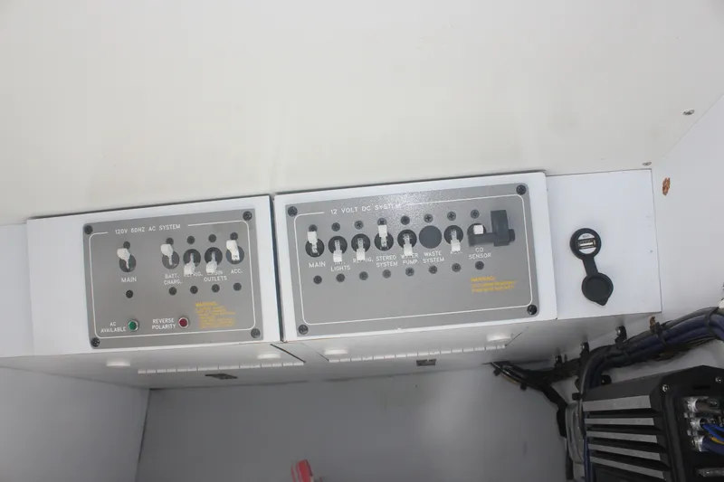 Slide: The Image of Control panel of a 2001 Formula 353 FASTech boat, featuring AC and DC systems. - 36