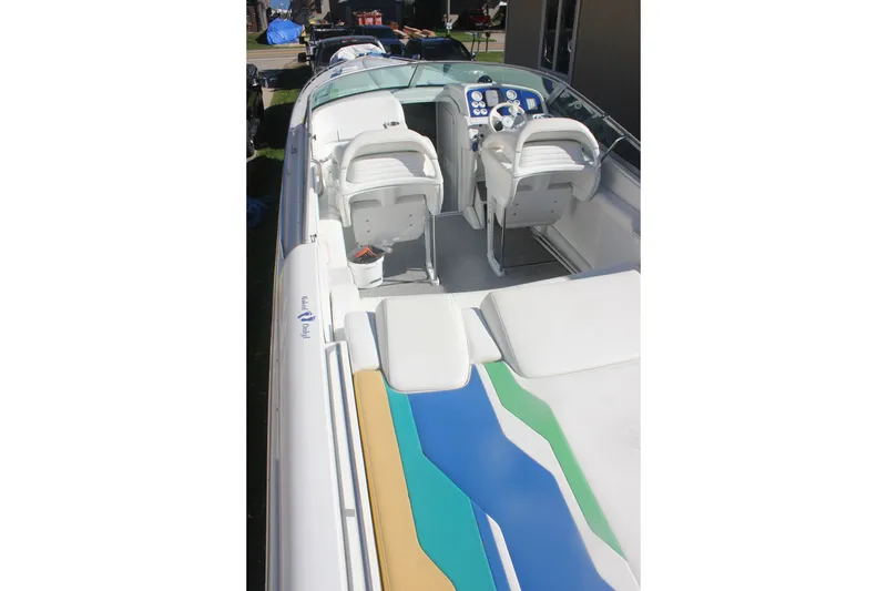 Slide: The Image of 2001 Formula 353 FASTech boat interior with colorful seating and dual helm chairs. - 10