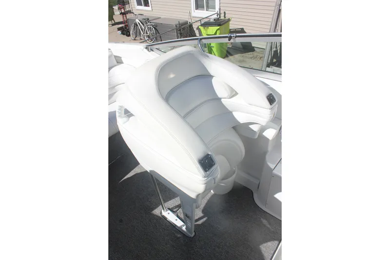 Slide: The Image of White leather seat on 2001 Formula 353 FASTech boat, outdoor setting. - 19