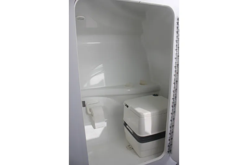 Slide: The Image of 2001 Formula 353 FASTech boat interior bathroom with compact toilet. - 34