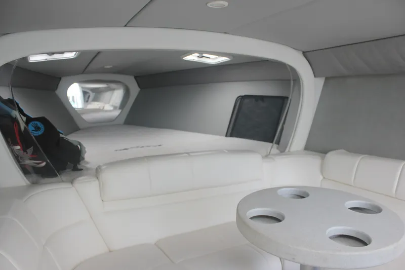 Slide: The Image of Interior of 2001 Formula 353 FASTech boat with white seating and table. - 31
