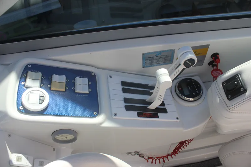 Slide: The Image of Control panel of a 2001 Formula 353 FASTech boat with throttle levers and switches. - 18