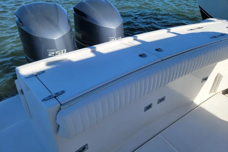Slide: The Image of 2004 Stamas 310 Tarpon boat with twin Yamaha 250 engines on water. - 10