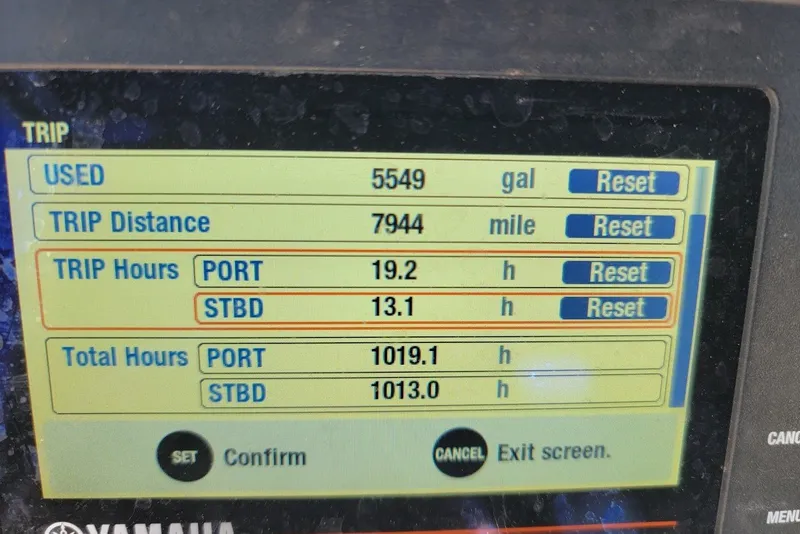 Slide: The Image of Display screen showing trip data for a 2004 Stamas 310 Tarpon boat. - 4