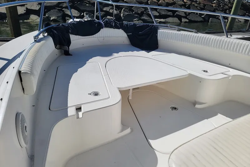 Slide: The Image of 2004 Stamas 310 Tarpon boat interior with seating and storage compartments. - 12