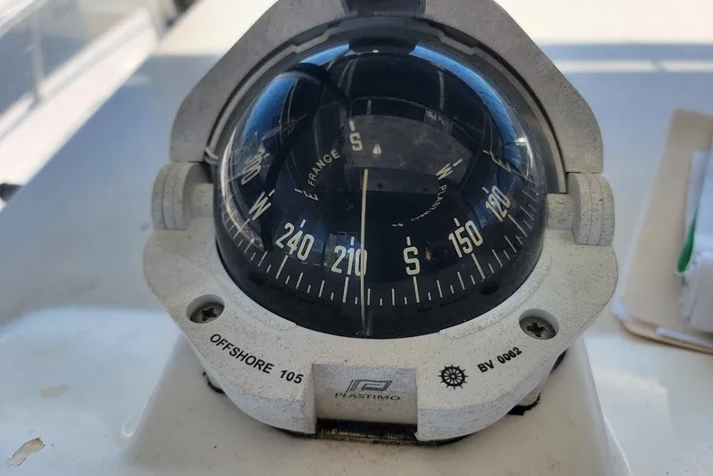 Slide: The Image of Close-up of a Plastimo Offshore 105 compass on a 2004 Stamas 310 Tarpon boat. - 19