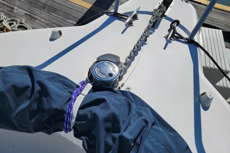 Slide: The Image of Bow of 2004 Stamas 310 Tarpon with anchor chain and winch. - 11