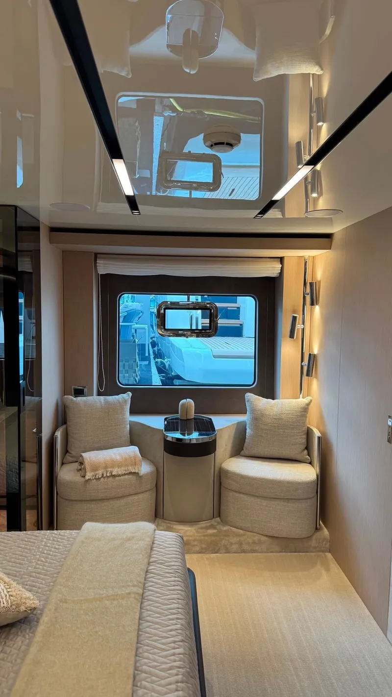 Slide: The Image of Luxurious interior of the Cranchi Sessantassette 67 with elegant seating and large windows. - 30