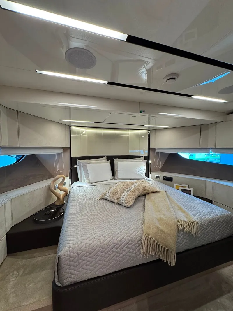 Slide: The Image of Luxurious cabin of the Cranchi Sessantassette 67 with a large bed and elegant decor. - 20