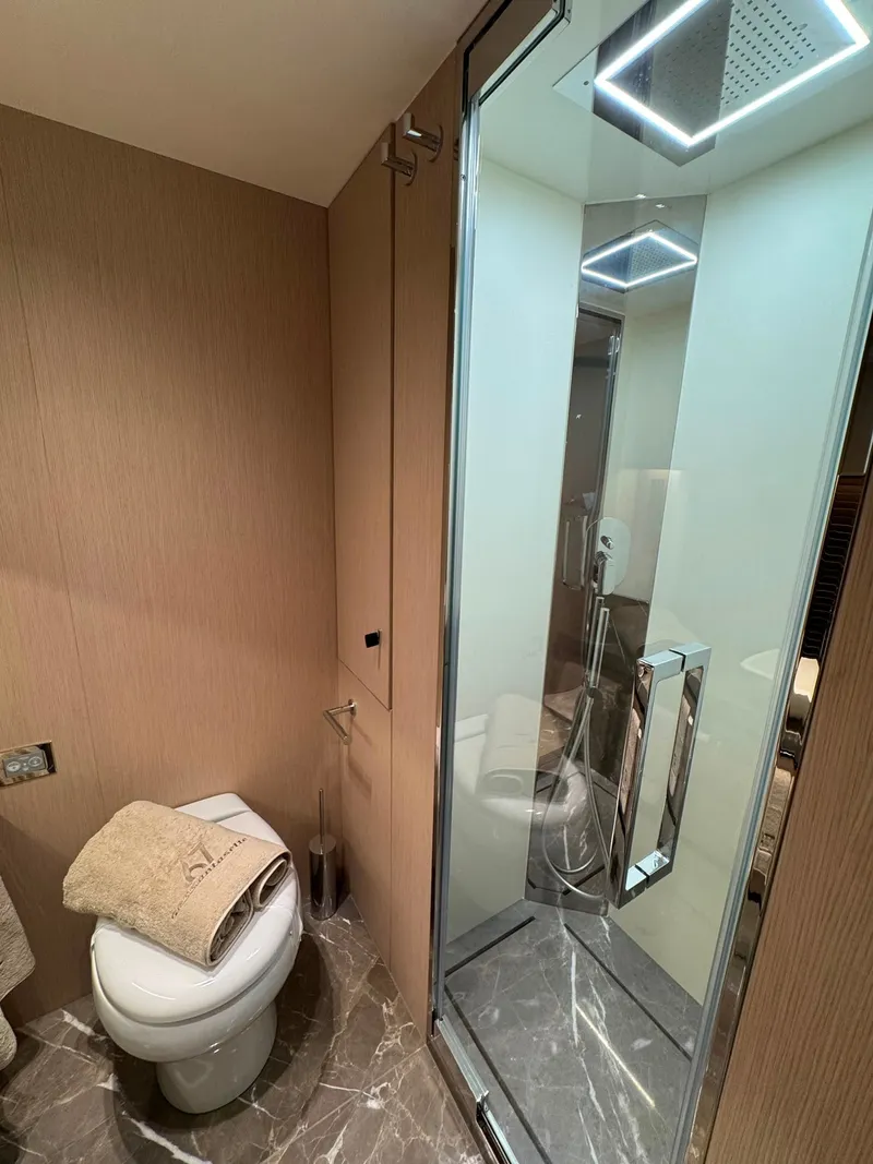 Slide: The Image of Luxurious bathroom with modern shower and toilet, featuring elegant marble flooring. - 25