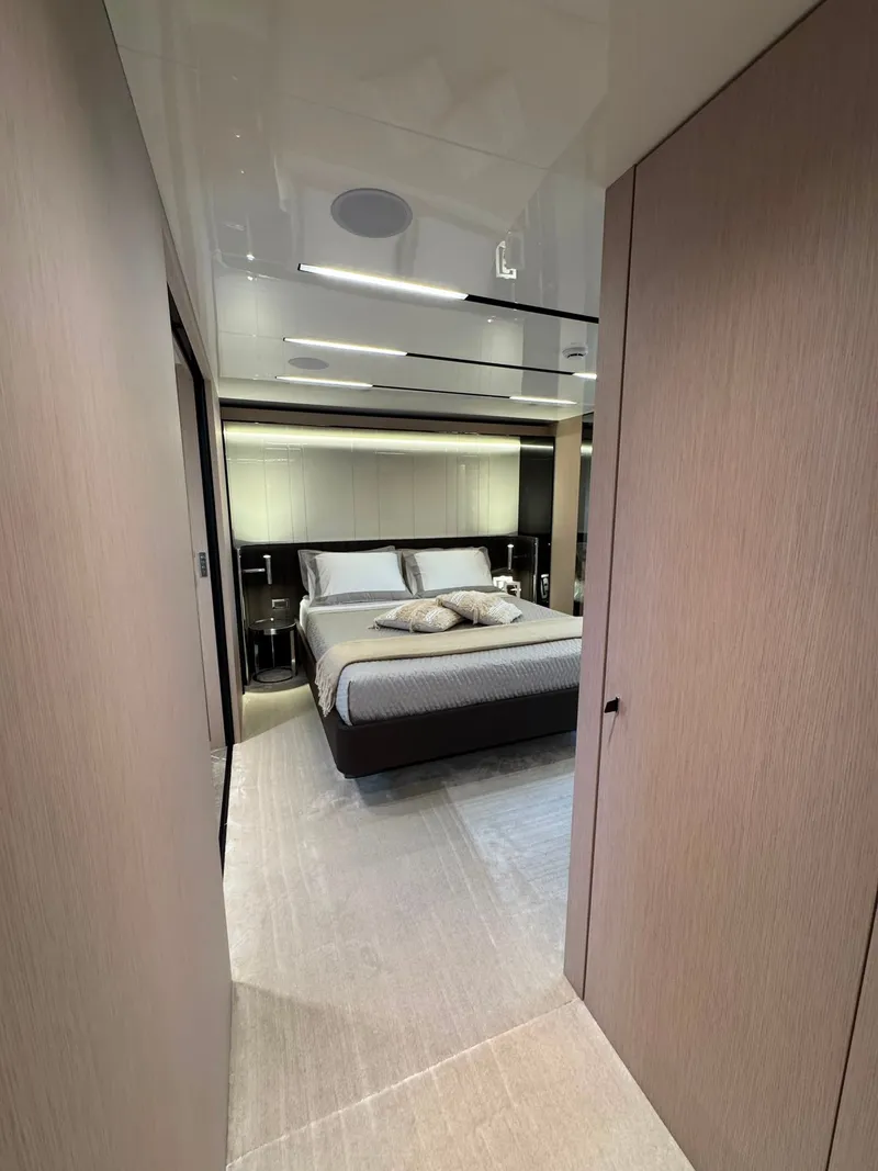 Slide: The Image of Interior of the 2026 Cranchi Sessantassette 67, featuring a modern bedroom with elegant decor. - 27