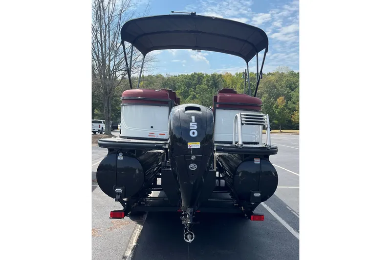 Slide: The Image of Rear view of 2027 Regency 230DL3 pontoon boat with 150 horsepower engine. - 1