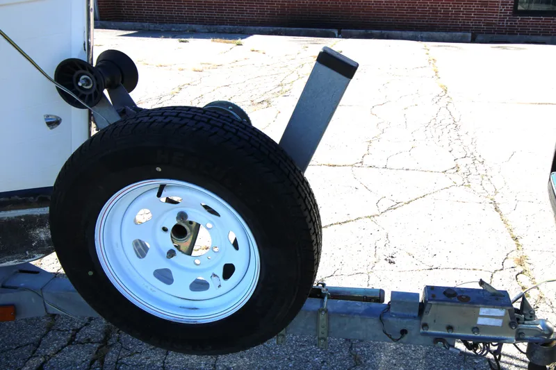 Slide: The Image of Trailer hitch with spare tire for 2005 Ranger Tugs R-21 boat. - 29