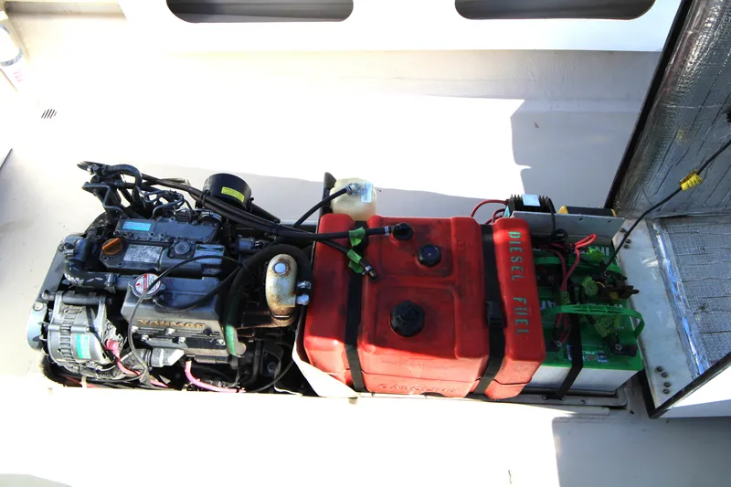 Slide: The Image of Engine compartment of a 2005 Ranger Tugs R-21 with diesel fuel tank and battery. - 12