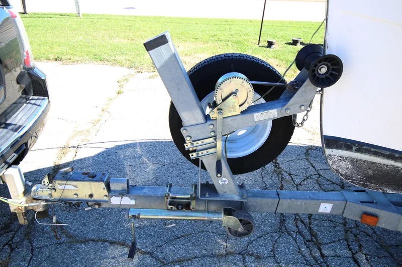 Slide: The Image of Trailer hitch and winch system for 2005 Ranger Tugs R-21 boat on pavement. - 28