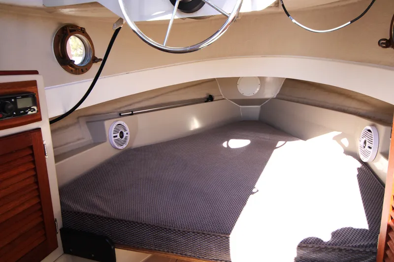Slide: The Image of Interior cabin of a 2005 Ranger Tugs R-21 boat with cozy sleeping area. - 16