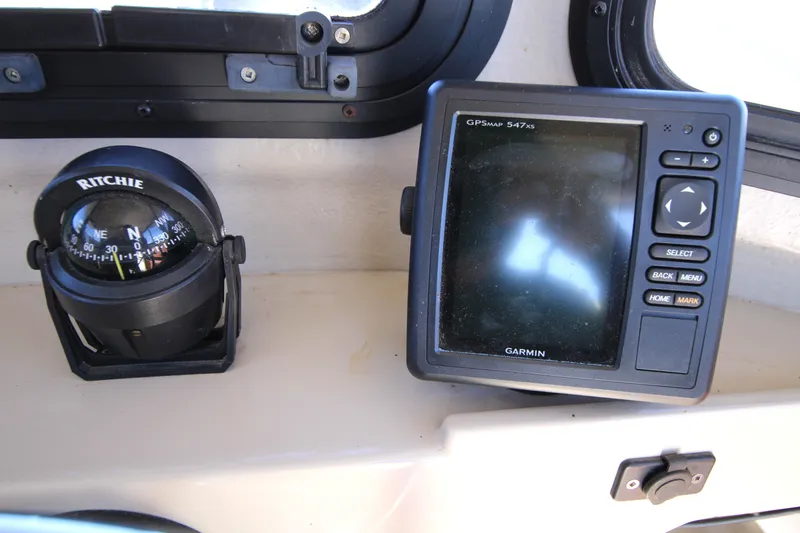 Slide: The Image of Compass and Garmin GPS on 2005 Ranger Tugs R-21 dashboard. - 22