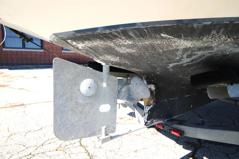 Slide: The Image of 2005 Ranger Tugs R-21 boat propeller and rudder detail on trailer. - 26