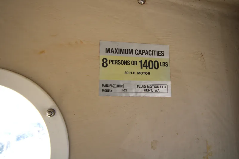 Slide: The Image of Capacity label on 2005 Ranger Tugs R-21, 8 persons or 1400 lbs, 30 HP motor. - 23