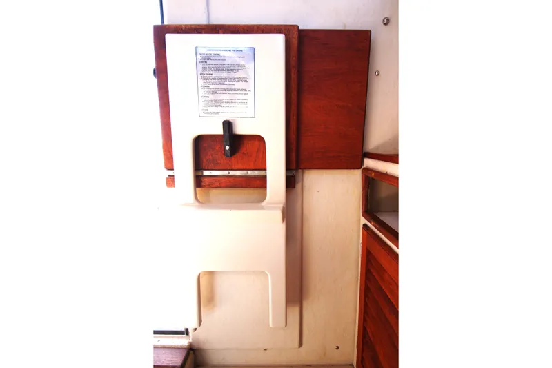 Slide: The Image of Interior of 2005 Ranger Tugs R-21 boat with wooden and white paneling. - 19