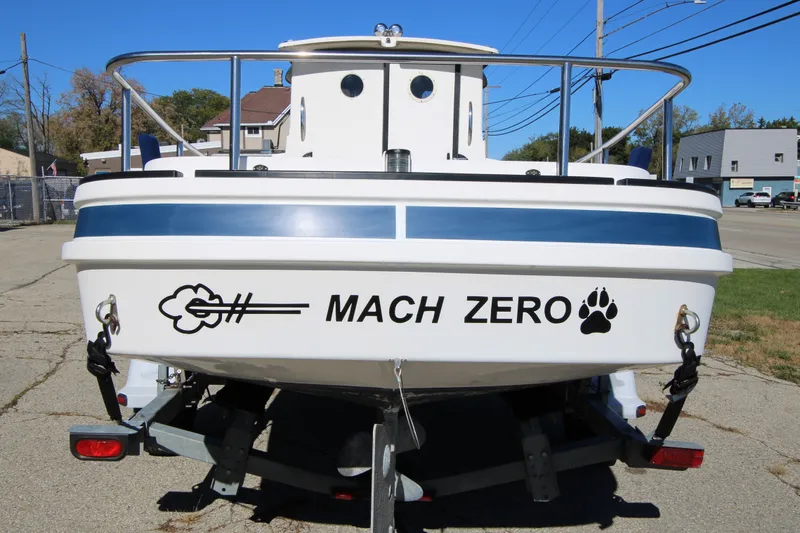 Slide: The Image of 2005 Ranger Tugs R-21 boat named "Mach Zero" on a trailer, rear view. - 27