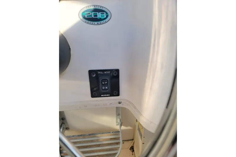 Slide: The Image of 1999 Grady-White Adventure 208 boat dashboard with troll mode switch. - 7