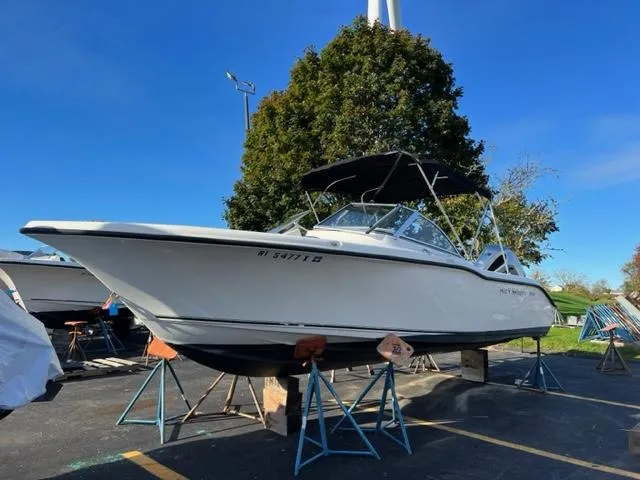 The Image of 2020 Key West 239 DFS boat on stands in a parking lot. - 0