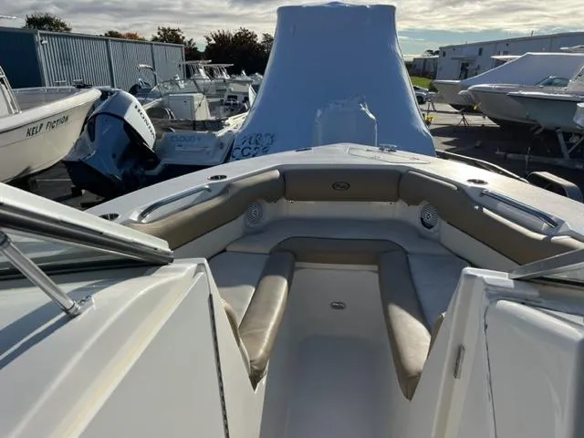 Slide: The Image of 2020 Key West 239 DFS boat interior, bow seating area in a marina. - 2