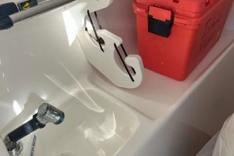 Slide: The Image of Key West 239 DFS 2020 boat sink and red storage box. - 13