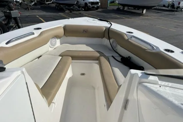 Slide: The Image of 2019 Key West 239 DFS boat interior with beige seating and white accents. - 12