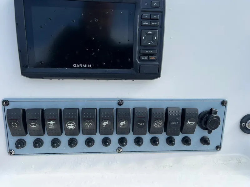 Slide: The Image of Control panel of a 2020 Key West 239 DFS boat with Garmin display. - 13