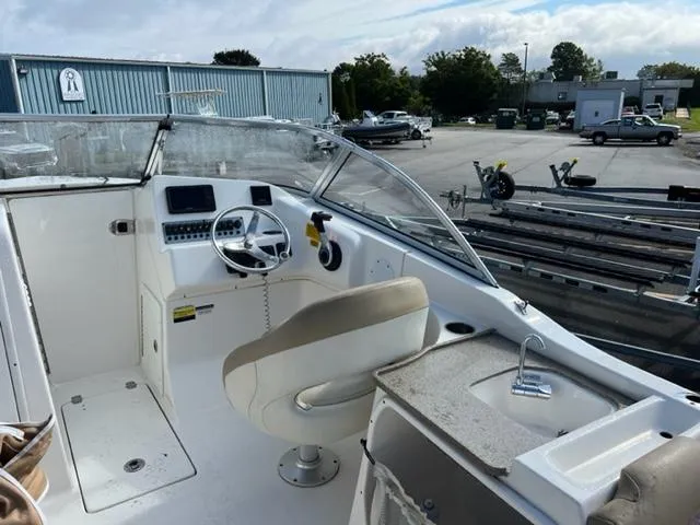 Slide: The Image of 2020 Key West 239 DFS boat interior with captain's chair and control panel. - 14