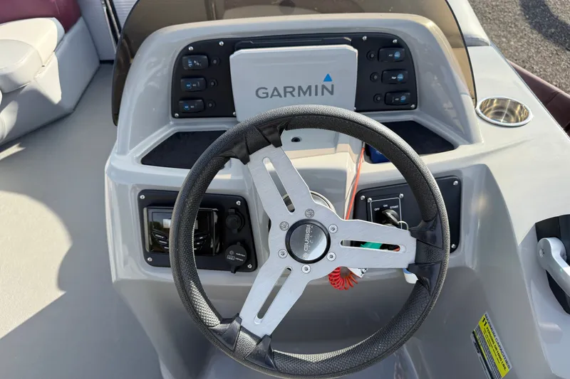 Slide: The Image of Steering console of 2021 Manitou Aurora 21 with Garmin navigation system. - 11