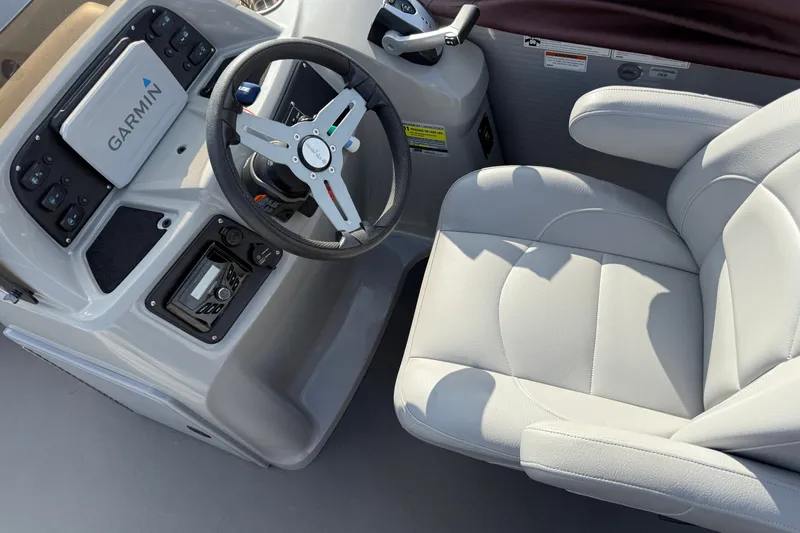 Slide: The Image of Steering console of 2021 Manitou Aurora 21 boat with Garmin navigation system. - 9